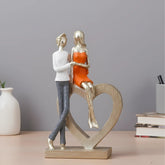Romantic Couple with Heart Sculpture