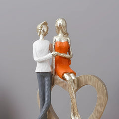 Romantic Couple with Heart Sculpture