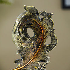 Golden Leaf-Inspired Decorative Sculpture on Black Base