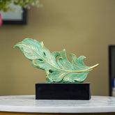 Green and Gold Feather Sculpture with Artistic Flow Design