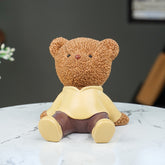 Brown Teddy Bear Figurine in Yellow Hoodie