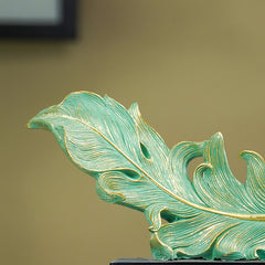 Green and Gold Feather Sculpture with Artistic Flow Design