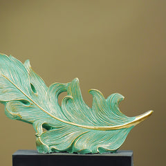 Green and Gold Feather Sculpture with Artistic Flow Design