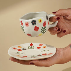 Hand Painted Ceramic Cup and Saucer Set with Floral Pattern