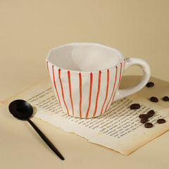 White Ceramic Cup with Hand-Painted Red Stripes