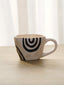 White Ceramic Mug with Hand-Painted Black Arch Design - The Golden Theory
