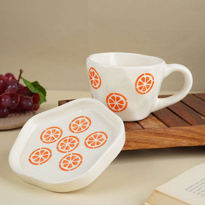 Cream Ceramic Cup with Orange Slice Motif