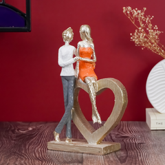 Romantic Couple with Heart Sculpture