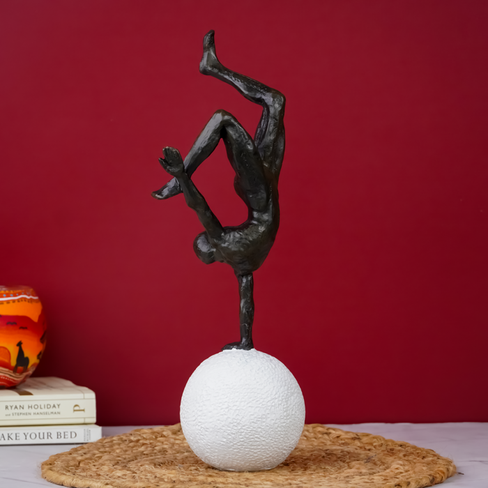 Black Gymnast Sculpture on White Sphere