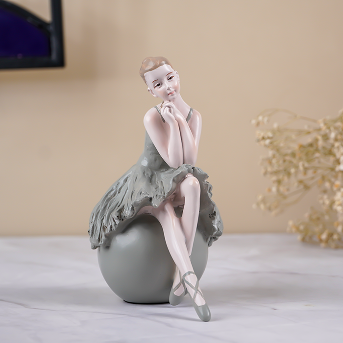 Ballerina Figurine Sitting on Sphere