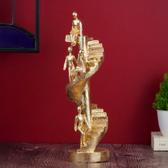 Gold Figures on Spiral Staircase Sculpture