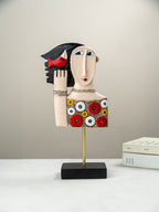 Colorful Abstract Face Sculpture with Red Bird