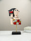 Colorful Abstract Face Sculpture with Red Bird