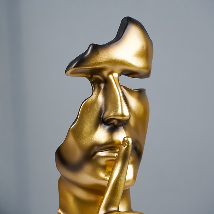 Gold Face Sculpture with Shhh Gesture