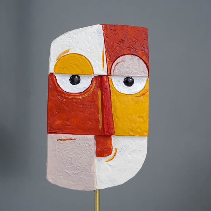 Vibrant Abstract Face Sculpture in Red, Yellow, and White