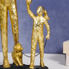 Gold Family Sculpture with Balloon - Joyful Moments in Art