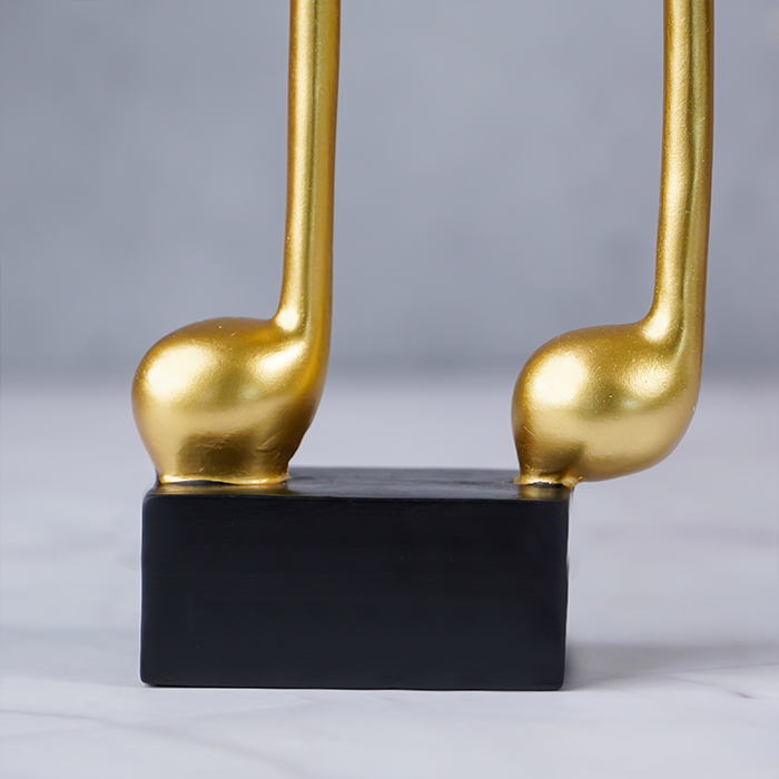 Gold Musical Note Figurine on Black Base