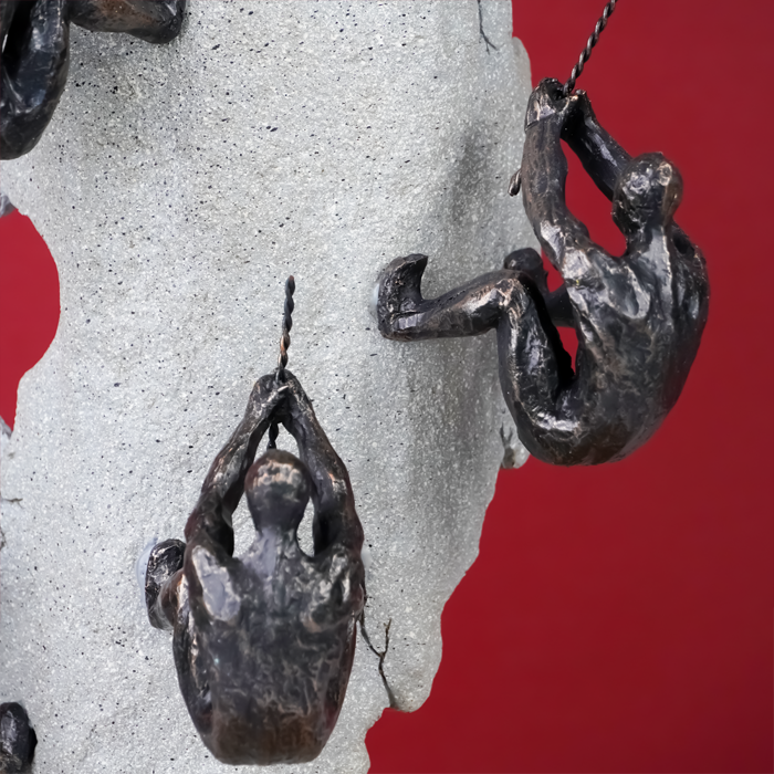 Black Climbers on Gray Rock Sculpture