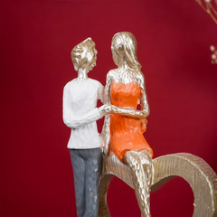 Romantic Couple with Heart Sculpture