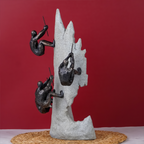 Black Climbers on Gray Rock Sculpture