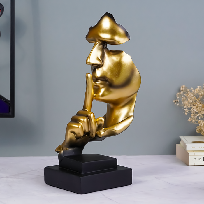 Gold Face Sculpture with Shhh Gesture