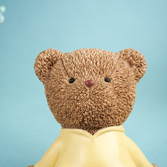 Brown Teddy Bear Figurine in Yellow Hoodie
