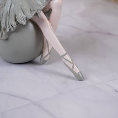 Ballerina Figurine Sitting on Sphere