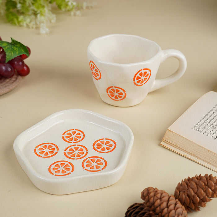 Cream Ceramic Cup with Orange Slice Motif