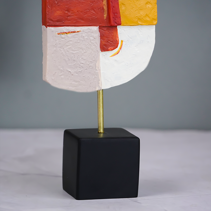 Vibrant Abstract Face Sculpture in Red, Yellow, and White