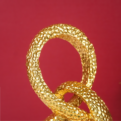 Gold Interlocking Loops Sculpture - Modern Textured Art