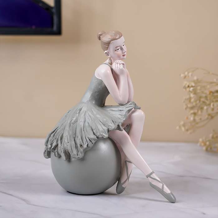 Ballerina Figurine Sitting on Sphere