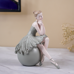 Ballerina Figurine Sitting on Sphere