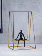 Black Figure on Gold Swing