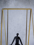 Black Figure on Gold Swing