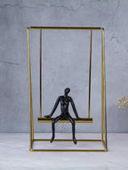 Black Figure on Gold Swing