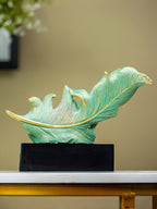 Green and Gold Feather Sculpture with Artistic Flow Design