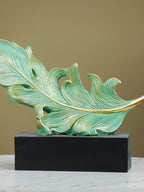 Green and Gold Feather Sculpture with Artistic Flow Design