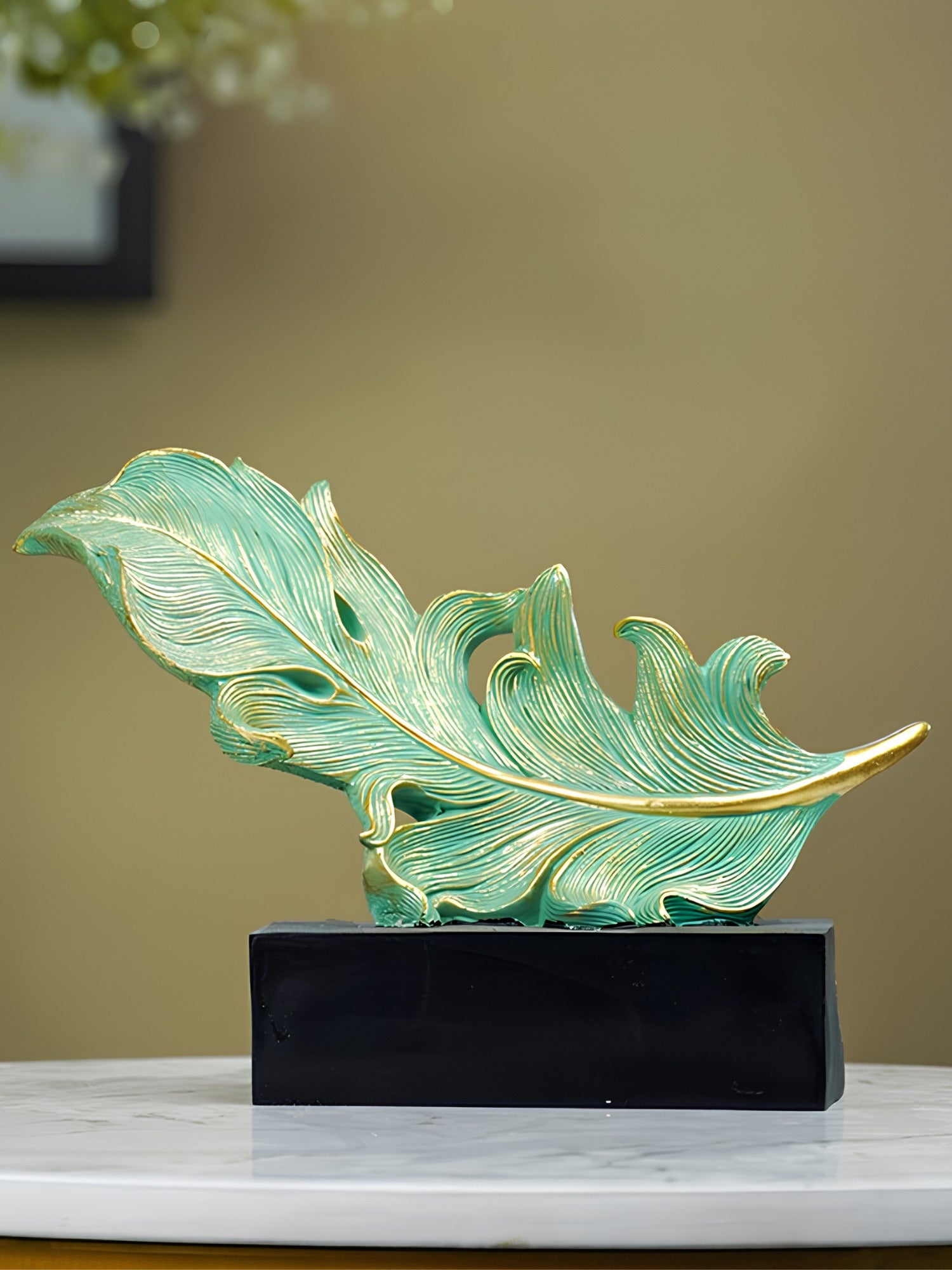 Green and Gold Feather Sculpture with Artistic Flow Design Main image