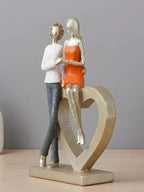 Romantic Couple with Heart Sculpture