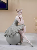 Ballerina Figurine Sitting on Sphere