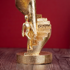 Gold Figures on Spiral Staircase Sculpture