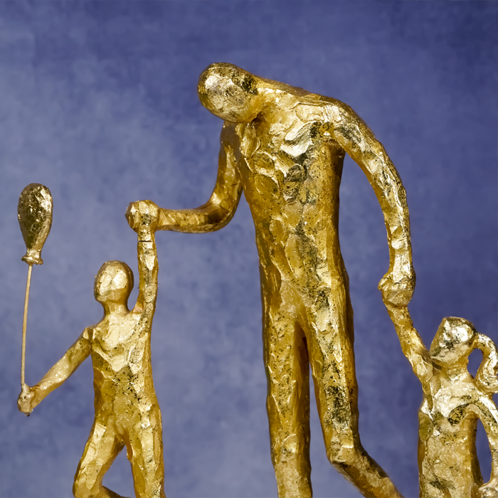 Gold Family Sculpture with Balloon - Joyful Moments in Art