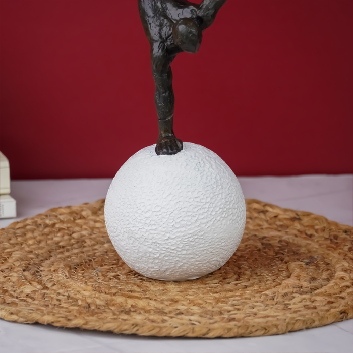 Black Gymnast Sculpture on White Sphere