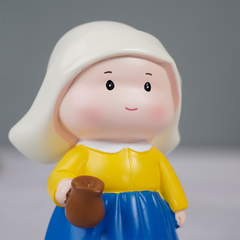 Yellow and Blue Dutch Girl Figurine with White Bonnet