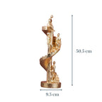Gold Figures on Spiral Staircase Sculpture