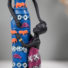 Mother and Child Sculpture with Vibrant Tribal Patterns