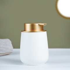 Elegant White Soap Dispenser with Gold Accents