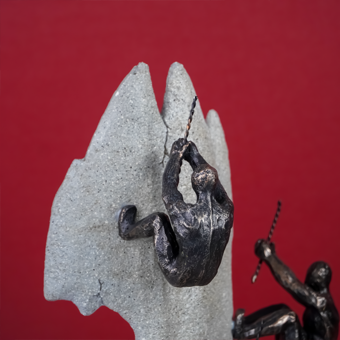 Black Climbers on Gray Rock Sculpture