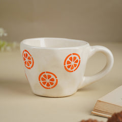 Cream Ceramic Cup with Orange Slice Motif