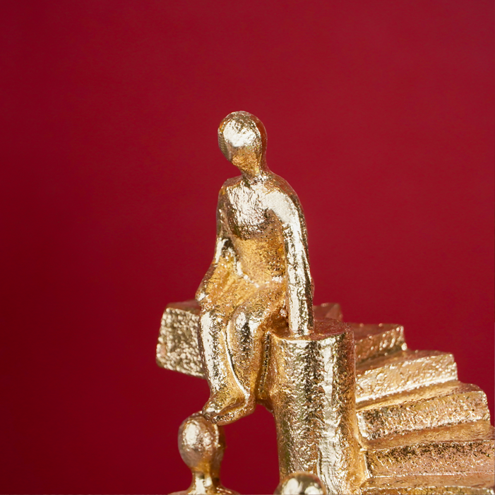 Gold Figures on Spiral Staircase Sculpture